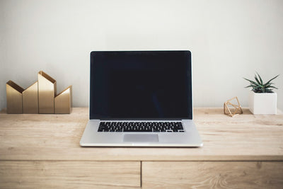 Business laptop on a wooden desk, representing the new wave of enterprise notebooks launching in India