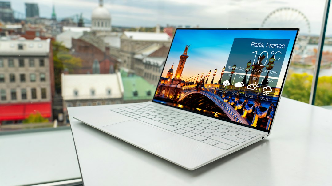 Laptop on a table, representing the choice between premium AI PCs and refurbished laptops in India