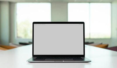 Laptop computer on a desk in a home workspace, representing budget laptop buying decisions in India
