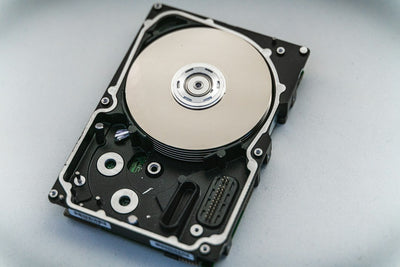 Close-up of an open hard disk drive, the storage component now caught in a global supply shortage