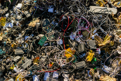 Discarded electronic devices piled up, representing e-waste headed for recycling in India