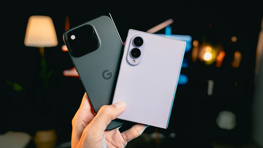 Two smartphones held side by side for comparison, representing the brand-stability question buyers face when choosing a phone in India